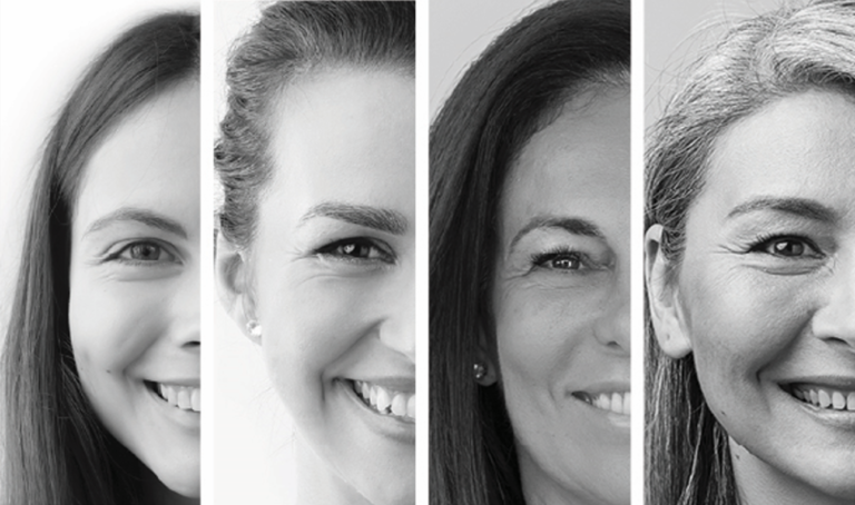 A black and white photo of 4 women from different ages/generations